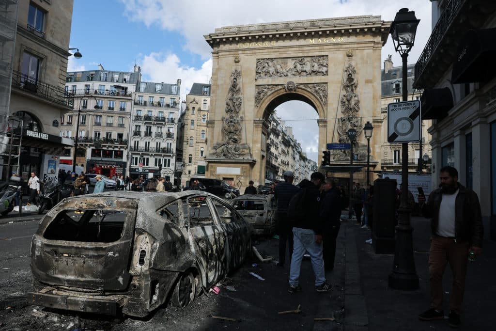 France imposes curfews after weekend rioting and looting